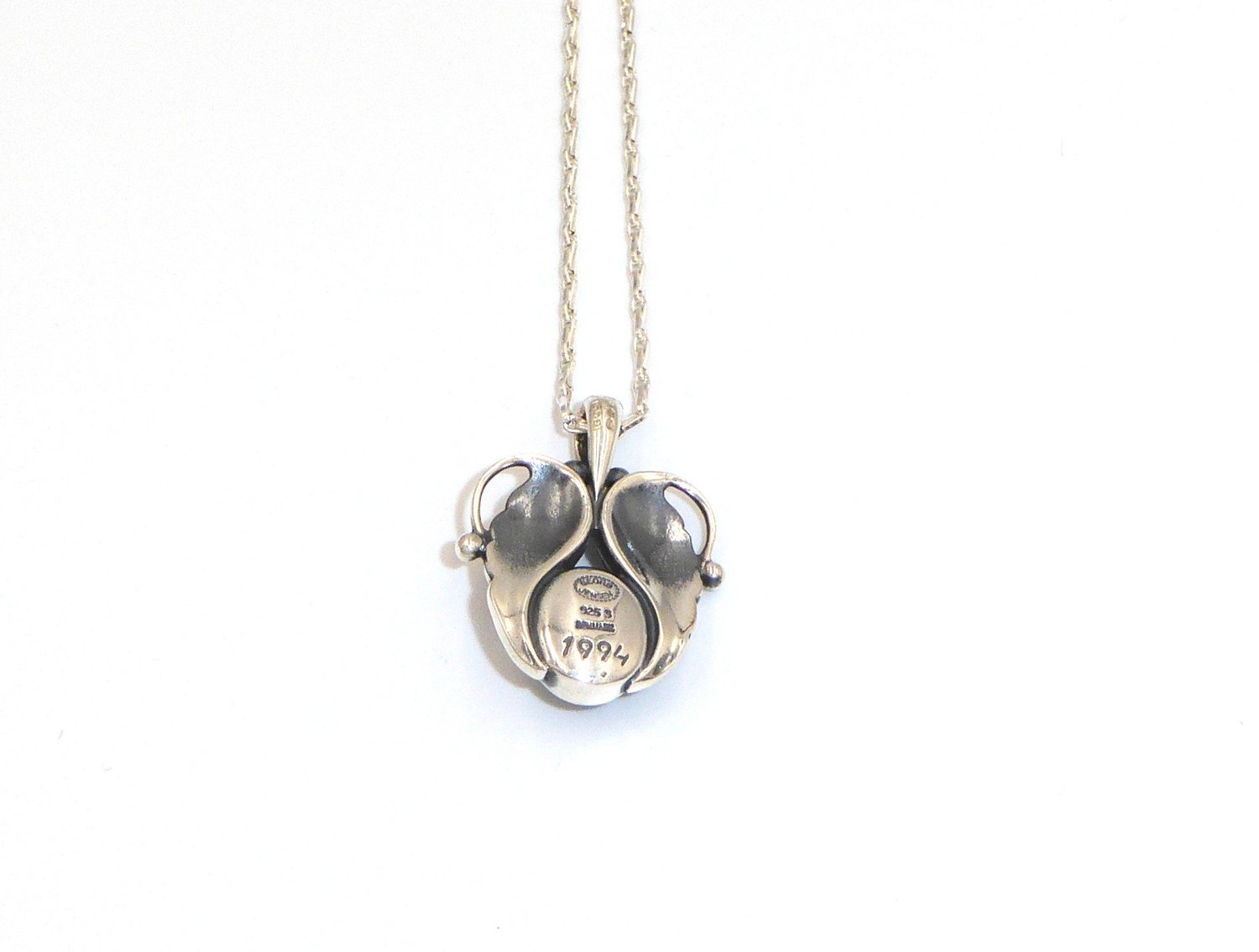 A vintage, Art Nouveau style, silver and garnet 'Pendant of the